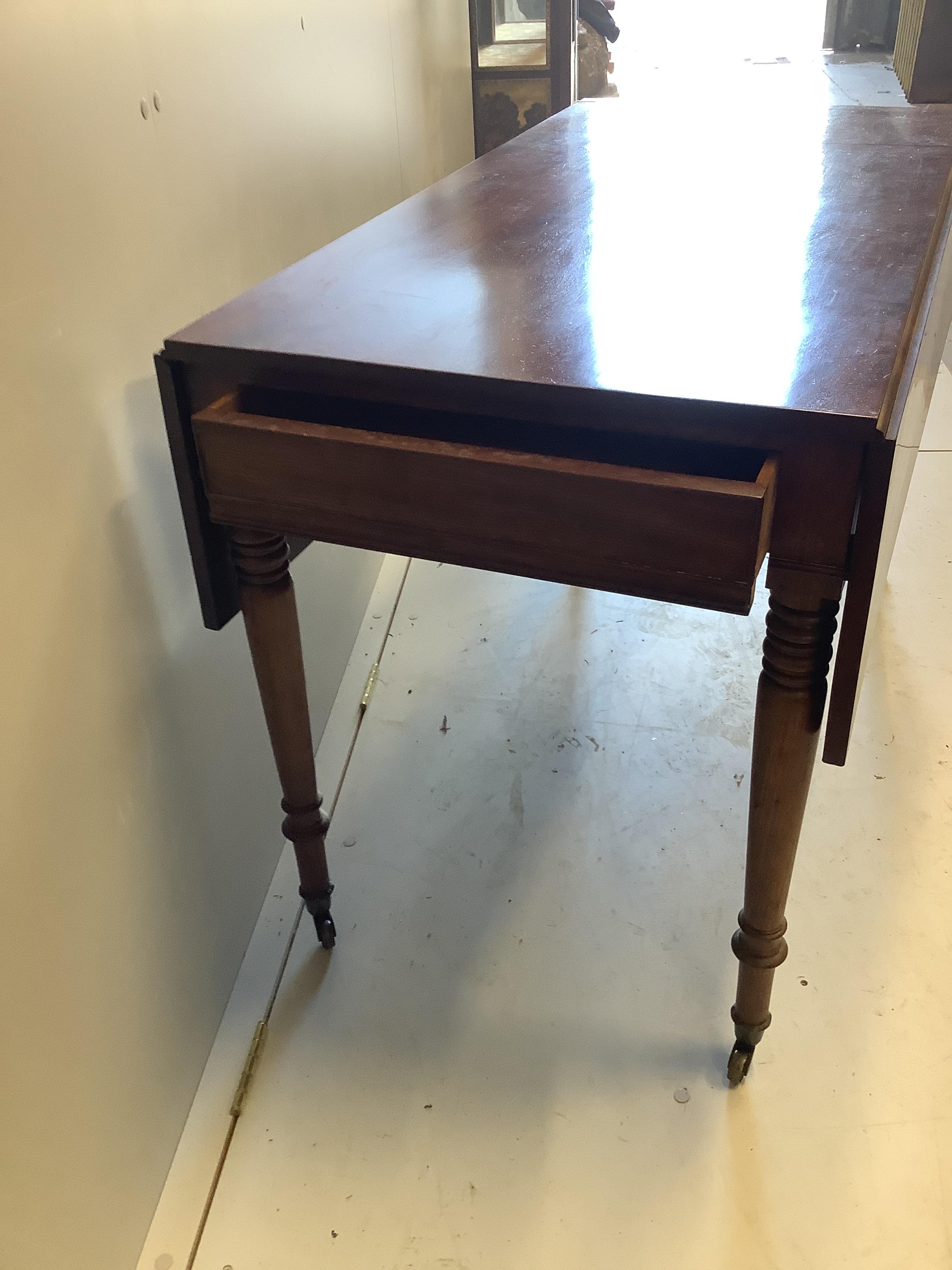 An early Victorian mahogany Pembroke table, width 114cm, depth 59cm, height 74cm together with a Victorian mahogany spoonback nursing chair